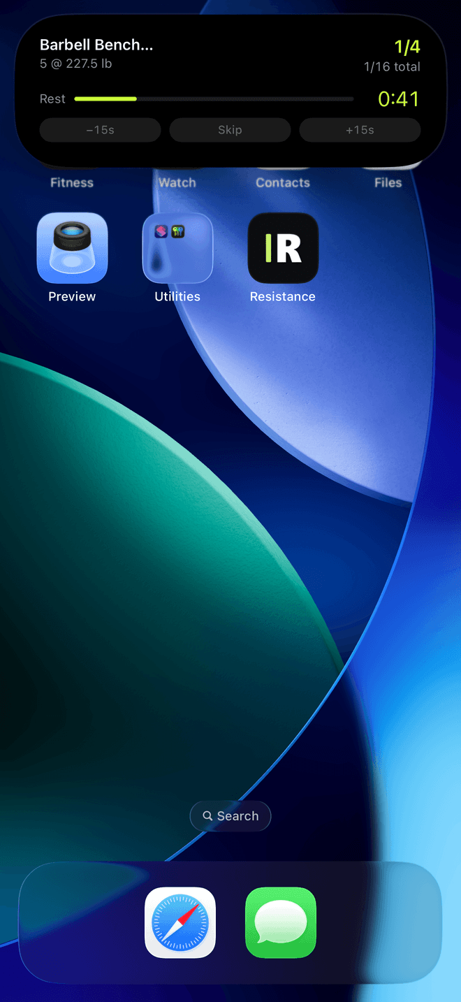 The Dynamic Island expanded over an iPhone home screen: Barbell Bench Press, 5 at 227.5 lb, 1 of 4 sets, a rest bar reading 0:41, and minus fifteen, Skip and plus fifteen controls