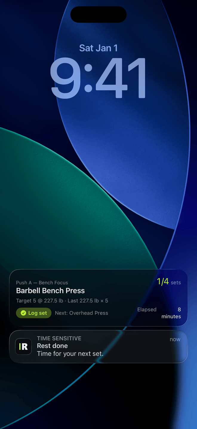 An iPhone lock screen with the Resistance Live Activity: Push A, Barbell Bench Press, 1 of 4 sets, target 5 at 227.5 lb, a Log set button, Next Overhead Press, and a Time Sensitive alert reading Rest done
