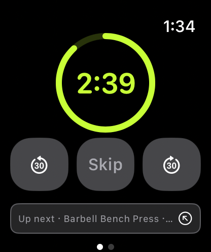 The rest countdown on the Apple Watch: a draining ring reading 2:39, minus thirty, Skip and plus thirty controls, and Up next Barbell Bench Press